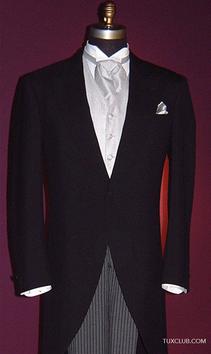 Black formal morning suit with silver vest and ascot on a mannequin against a purple background
