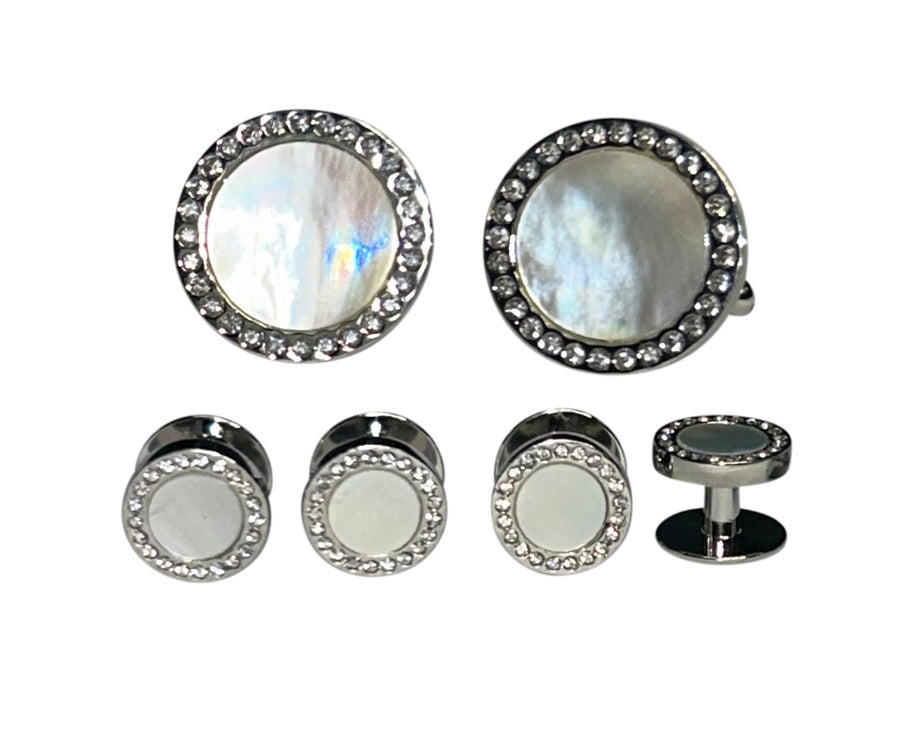 close up mother-of-pearl cufflinks and studs set in silver setting with crystals