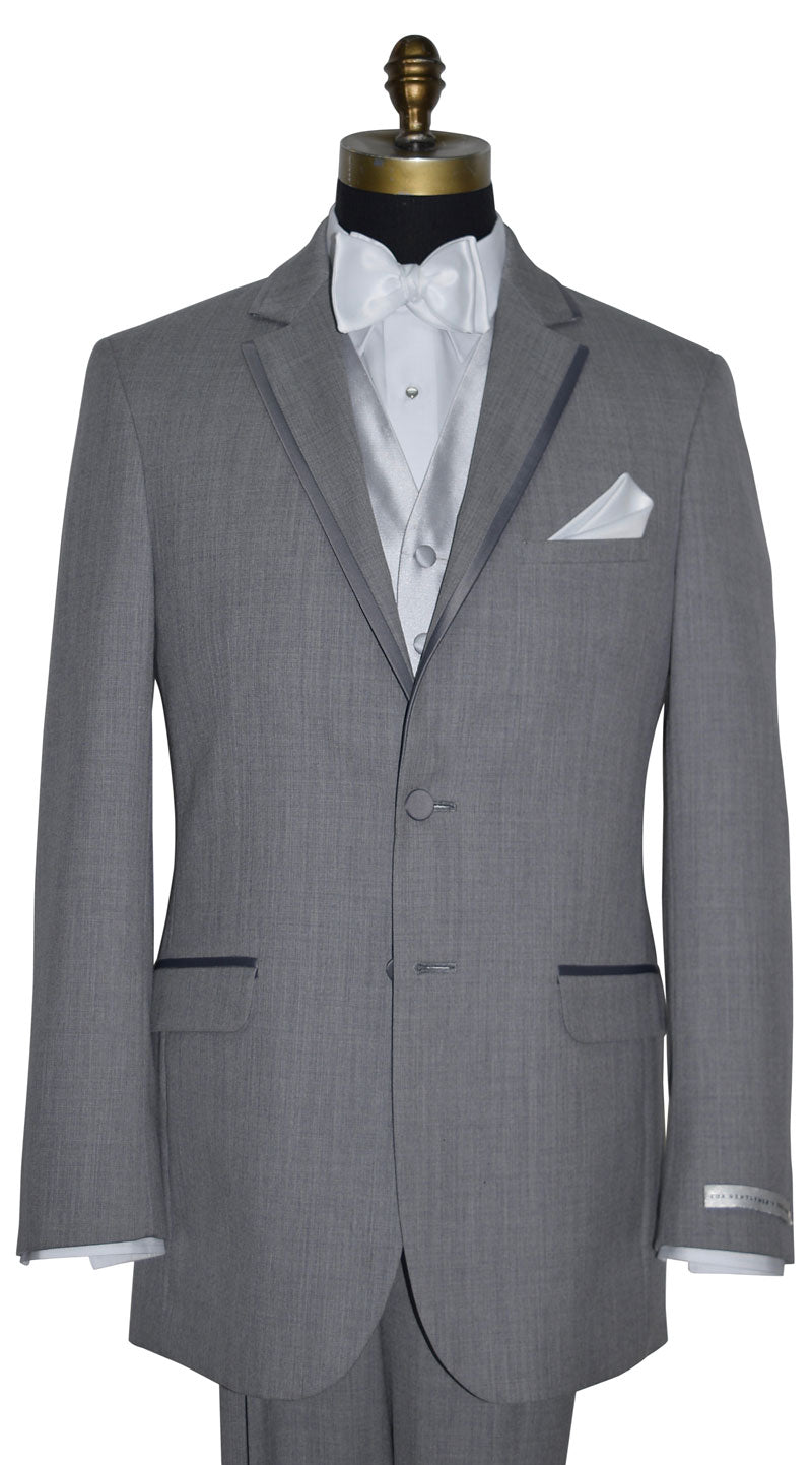 close up front view mannequin wearing a gray tuxedo with white vest and bowtie and pearl cufflinks and studs by San Miguel Formals against a white background