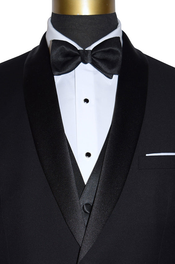 close up front view of Black shawl collar tuxedo, with white lay-down collar tuxedo shirt and black satin bowtie with a black vest