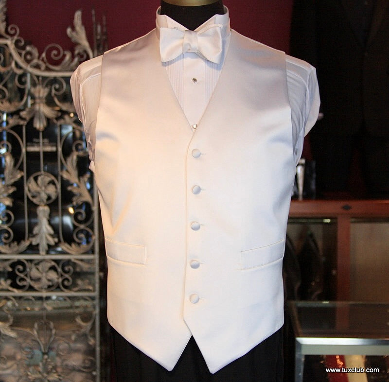 White satin vest with a white satin bow tie on a mannequin against a decorative background