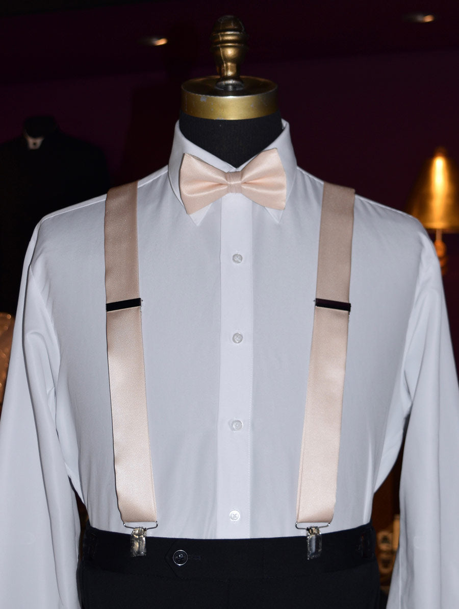close up of mannequin with white shirt and nude satin suspenders and nude bowtie