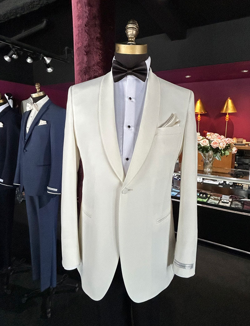 Mannequin wearing a off-white tuxedo jacket on a mannequin inside a tuxedo shop