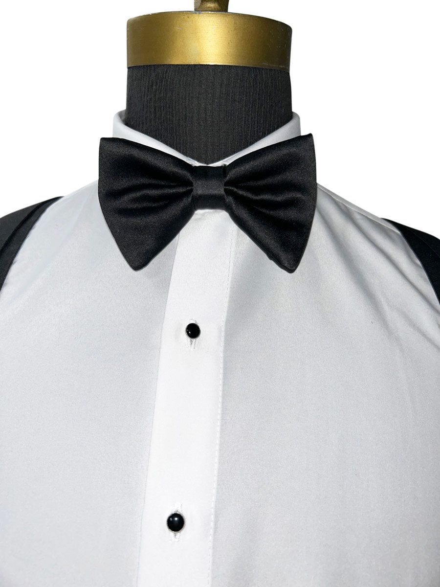 Black bow tie on a white shirt with black sleeves on a mannequin.
