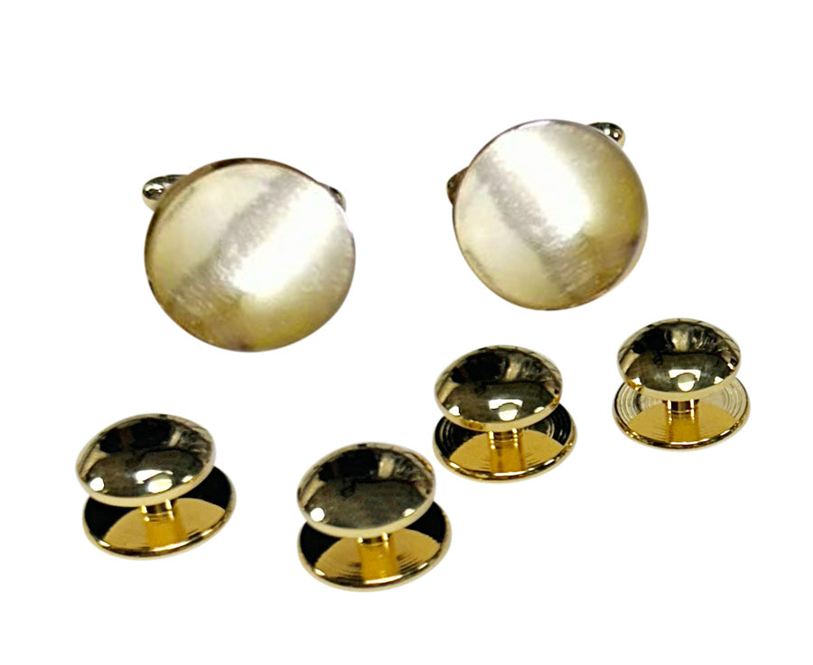 Gold military style cufflinks and matching studs on a white background