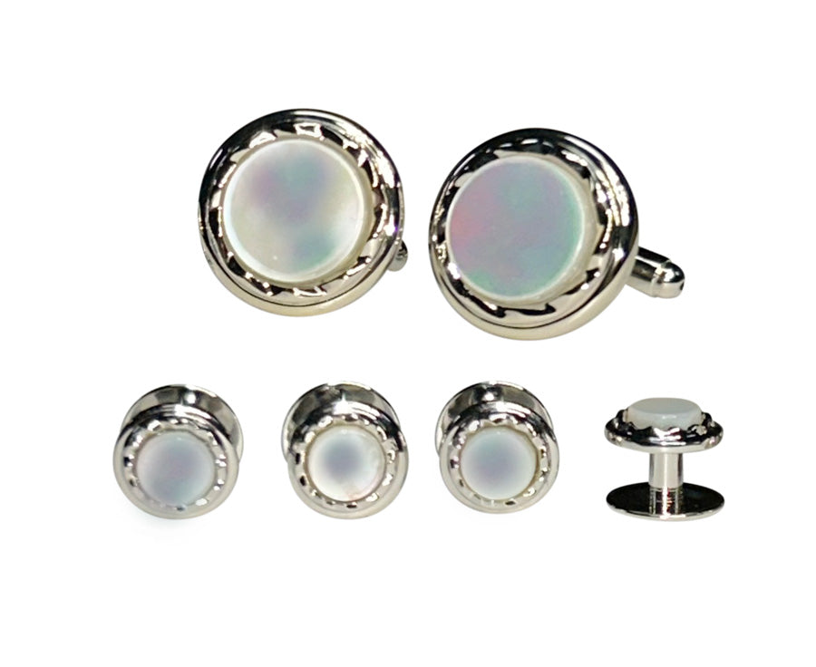 close-up mother-of-pearls Cufflink and studs set with silver setting on a white background