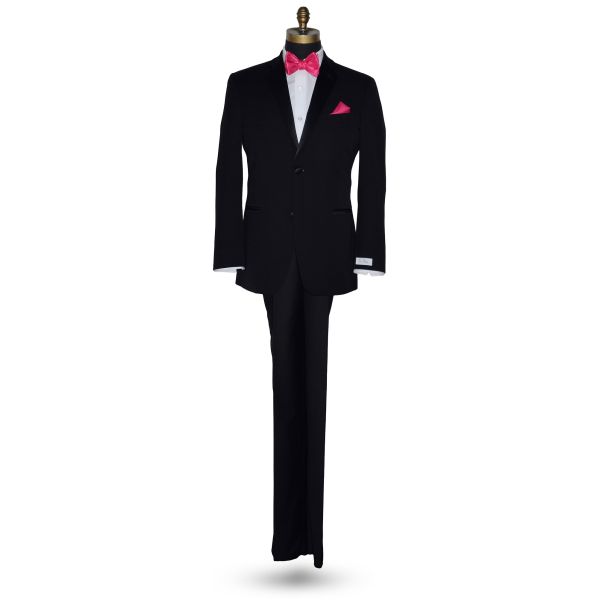 full length mannequin wearing a black tuxedo with a white dress shirt and a hot-pink silk "tie-yourself" bowtie against a white background
