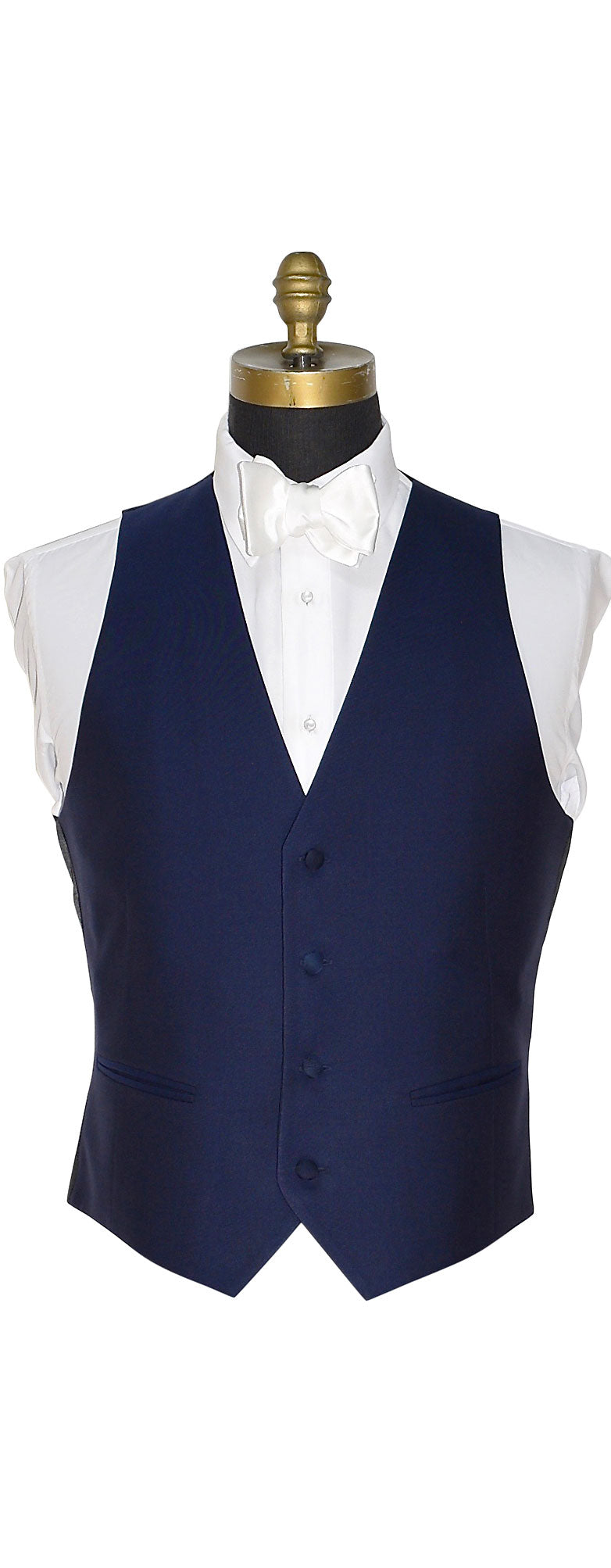 Close up view of a optional Navy blue vest for the navy notch tuxedo shown with a white satin "tie-yourself" bowtie against a white background