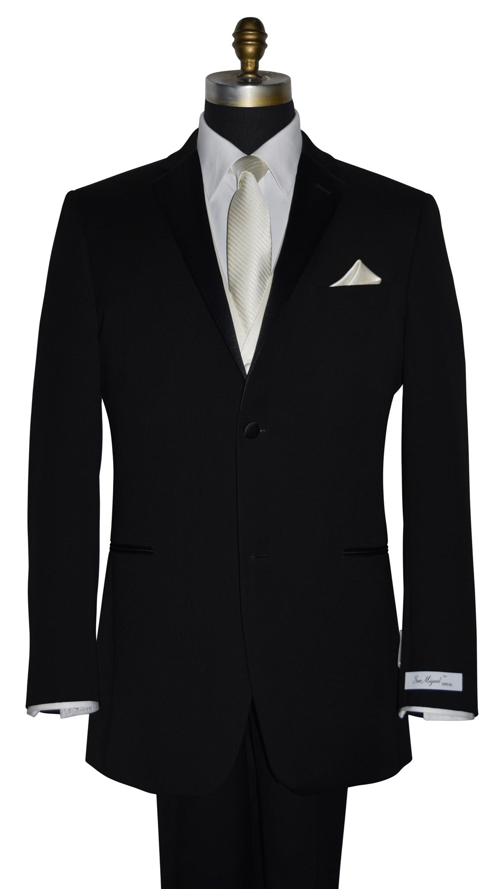 Black suit jacket with "San Miguel Especial" branded label and a white shirt with an off-white ivory subtle stripe necktie and pocket square on a mannequin against a white background
