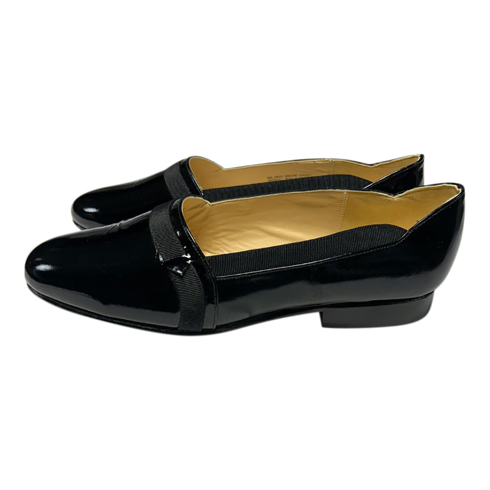 patent leather opera pump slim on tuxedo shoe against a white background