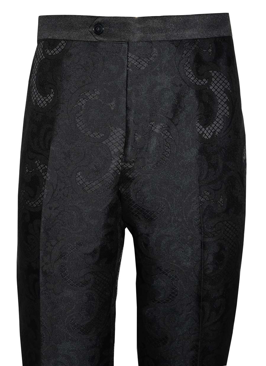 Close up of black paisley tuxedo pants against a white background