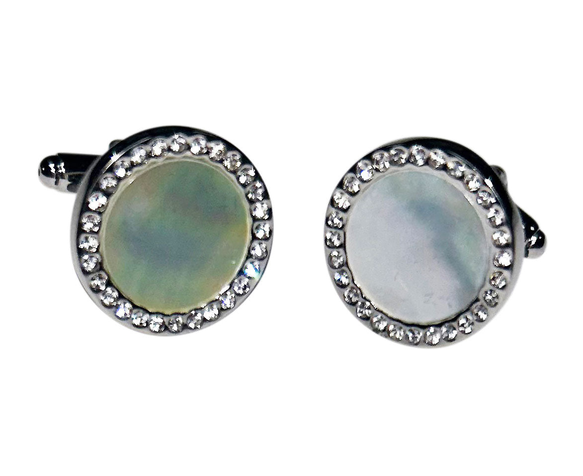 pearl cufflinks with crystal setting against a white background