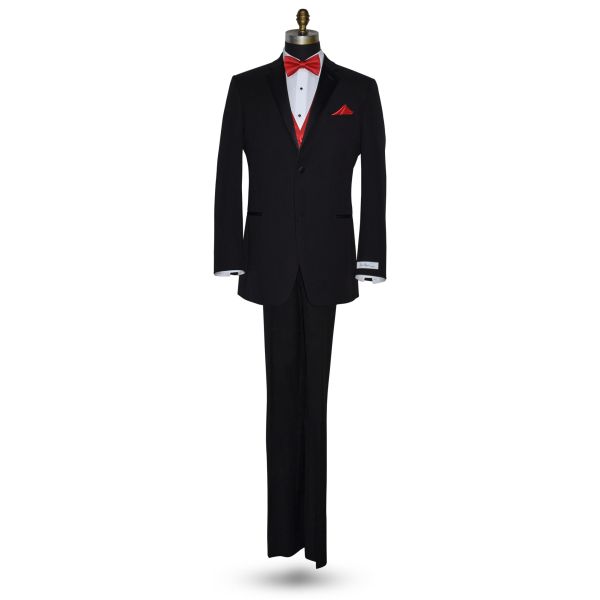 mannequin wearing a black tuxedo with a white tuxedo shirt and a red pre-tied bowtie and a matching red vest against a white background