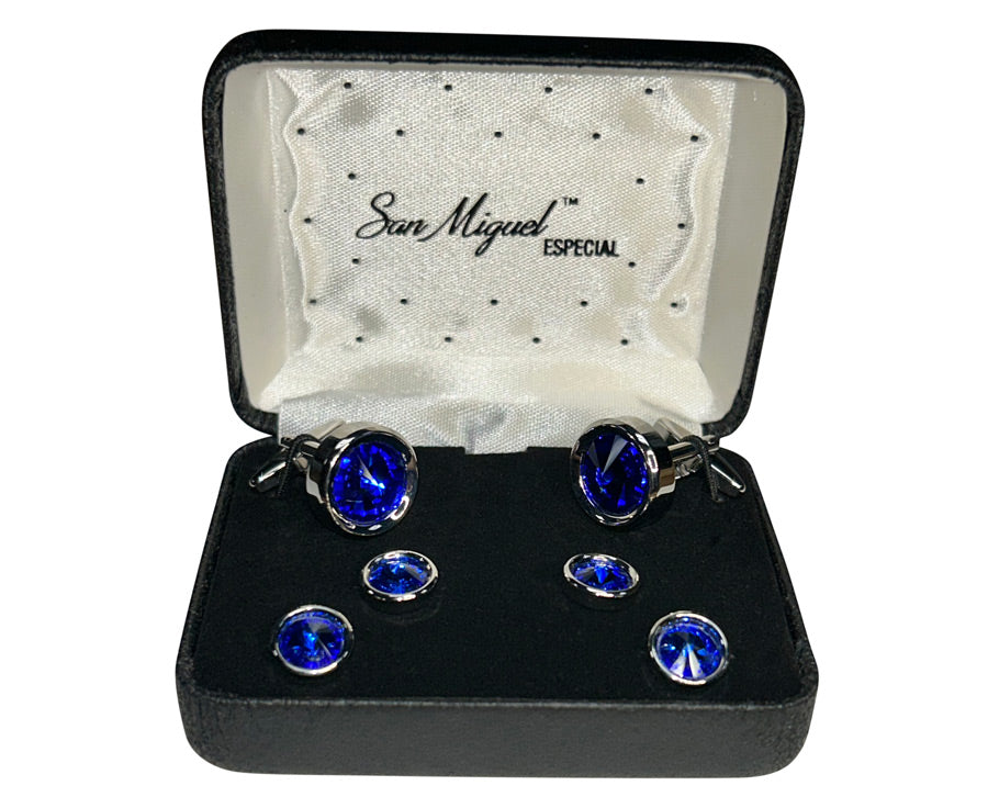 close-up of blue cufflinks and studs in a San Miguel Branded box against a white background.
