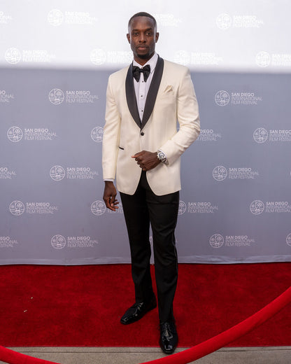 Close up man wearing an ivory tuxedo with black shawl collar at the San Diego film festival in La Jolla California