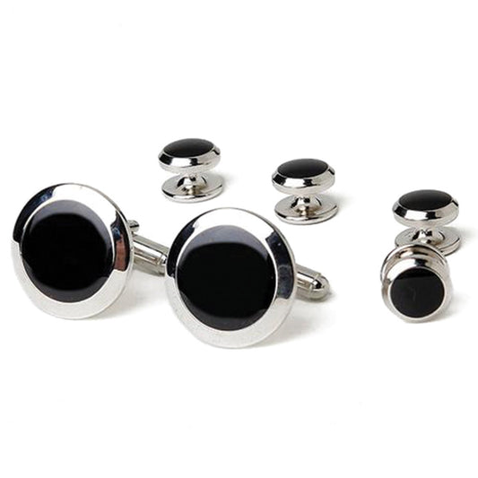 Cufflinks and studs set with black stones on a white background