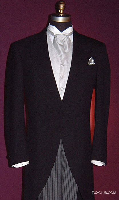 Black formal morning suit with silver vest and ascot on a mannequin against a purple background