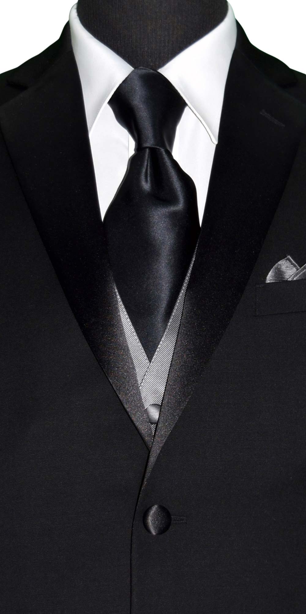 CLOSE-UP FRONT VIEW Black suit with gray vest, white shirt, and black silk neck-tie on a white background