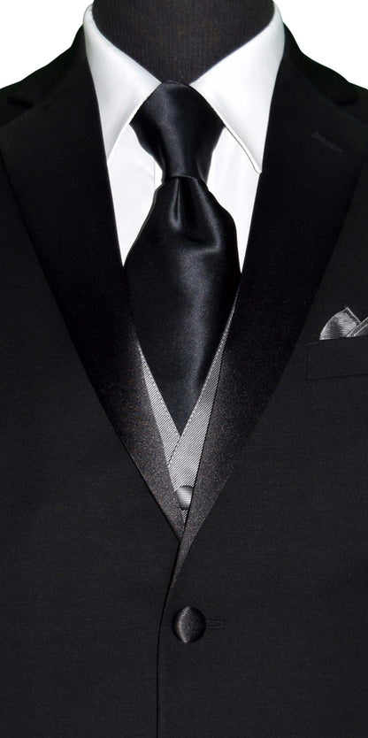 CLOSE-UP FRONT VIEW Black suit with gray vest, white shirt, and black silk neck-tie on a white background