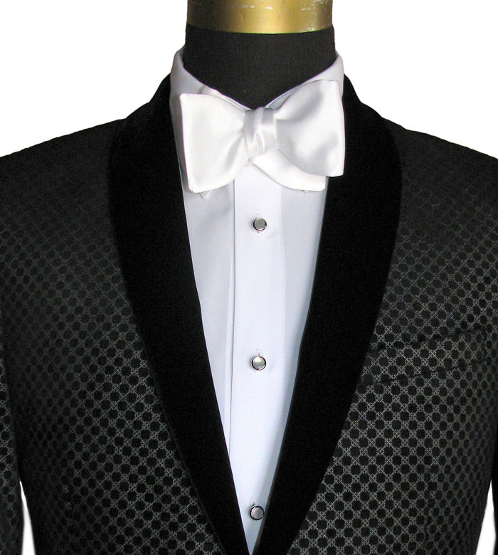 Black velvet shawl collar tuxedo jacket with white bow tie on a mannequin against a white background
