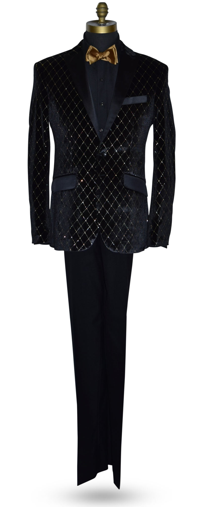 Black velvet jacket with gold diamonds shown with black pants with a gold bow tie on a mannequin against a white background