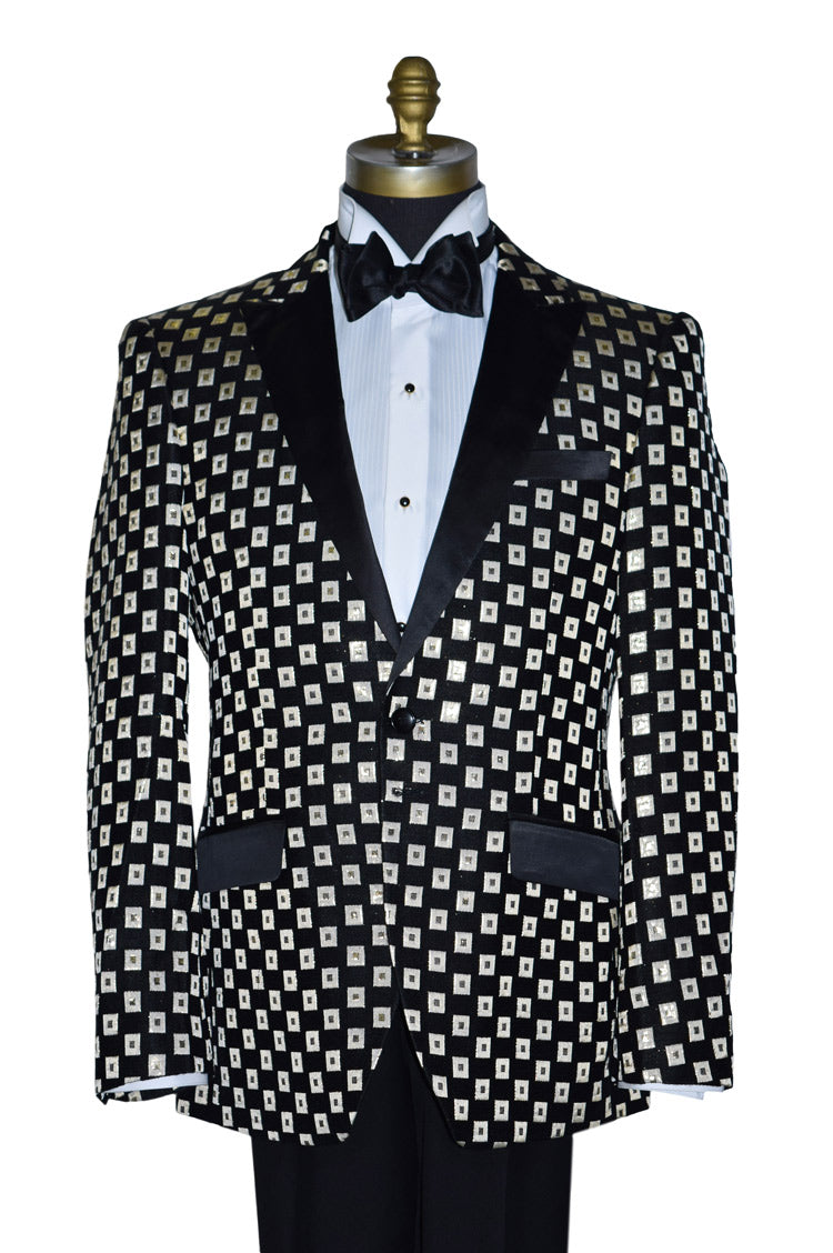 close-up life size mannequin wearing a black and gold tuxedo with a black bowtie against a white background