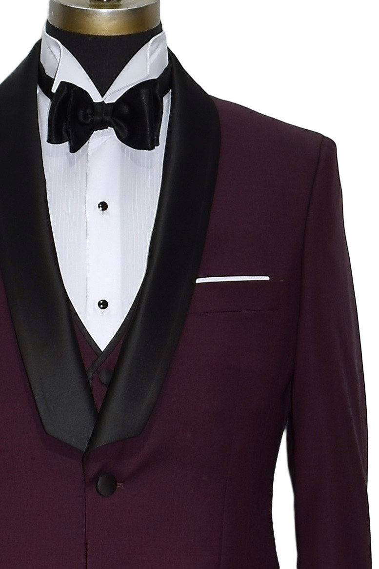 Burgundy tuxedo with black lapels and bow tie on a mannequin against a white background