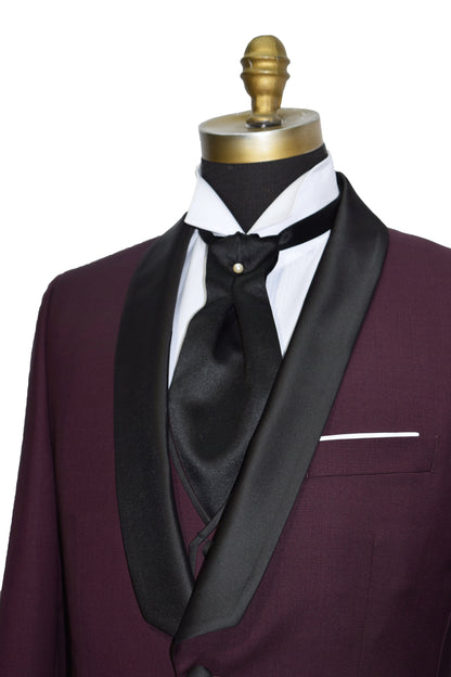 close-up view burgundy shawl collar tuxedo wearing a black ascot and matching burgundy vest
