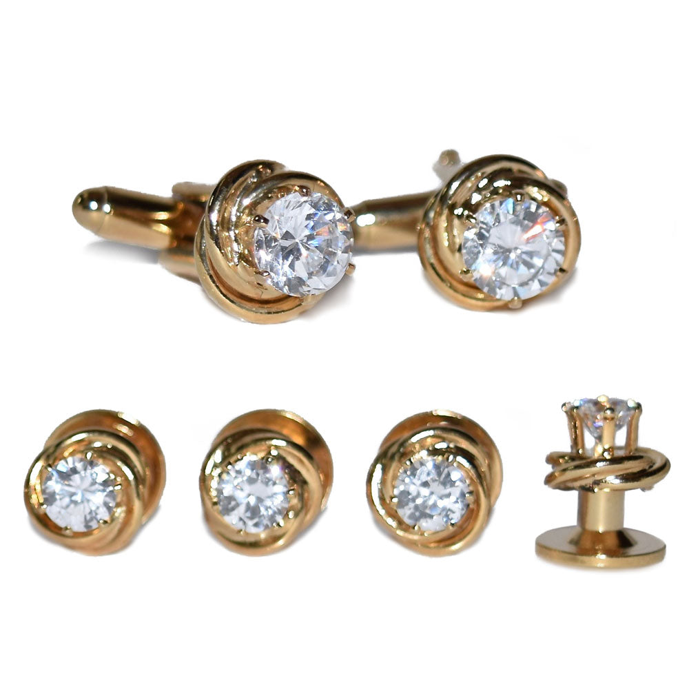 Cubic zirconia studs cufflinks with gold setting on a white background