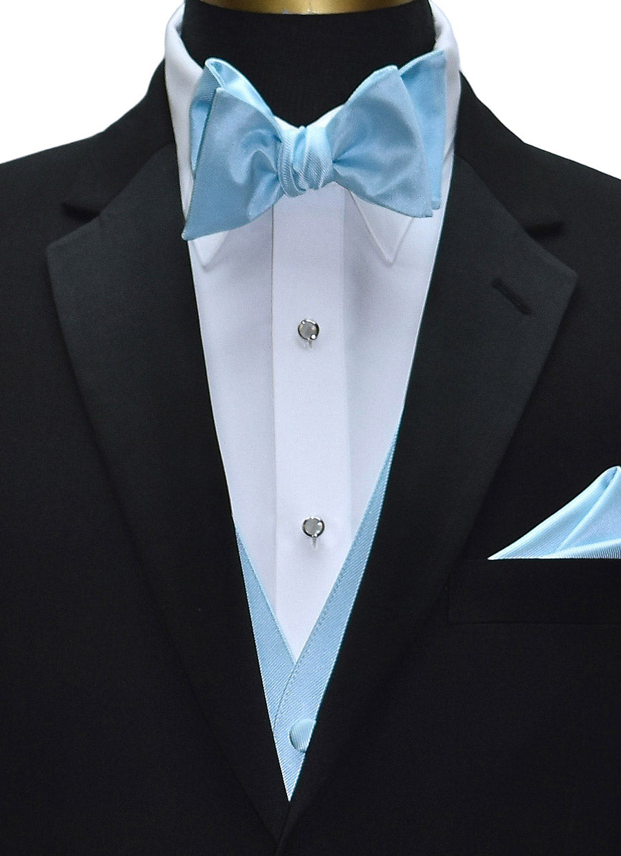 very close-up black tuxedo wearing a capri-blue "ie-yourself" bowtie and capri blue vest with a capri-blue pocket handkerchief against a white background