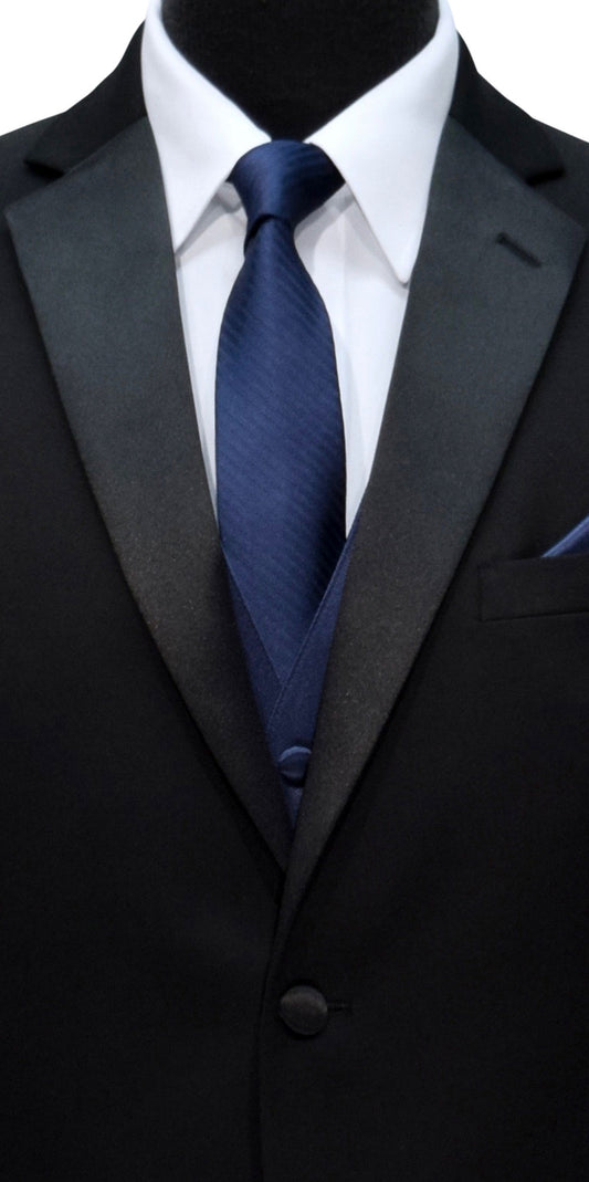 close-up Black tuxedo with a white shirt and marine-blue necktie on a mannequin.