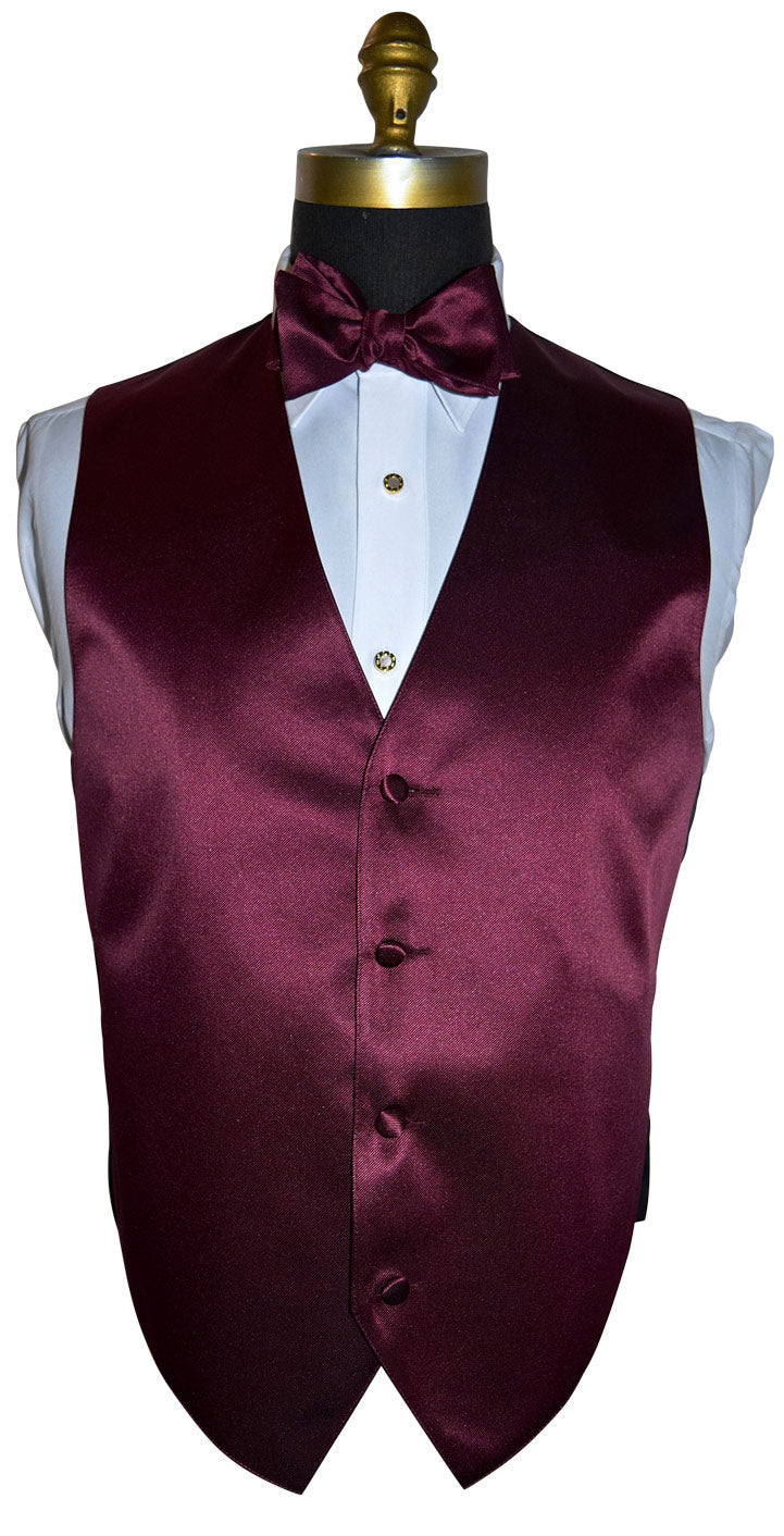 mannequin wearing a white tuxedo shirt with a wine tuxedo vest and wine bowtie against a white background