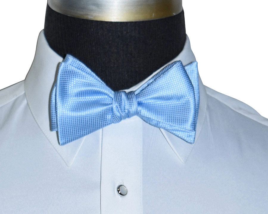 Light blue bow tie on a white shirt displayed on a mannequin 