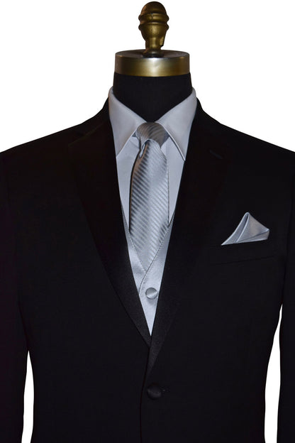 Black wedding suit with silver necktie and and silver vest and pocket square on a mannequin against a white background