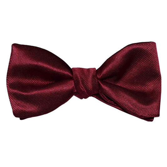 apple colored bow tie on a white background