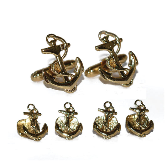 Set of gold anchor-shaped cufflinks and studs-on a white background