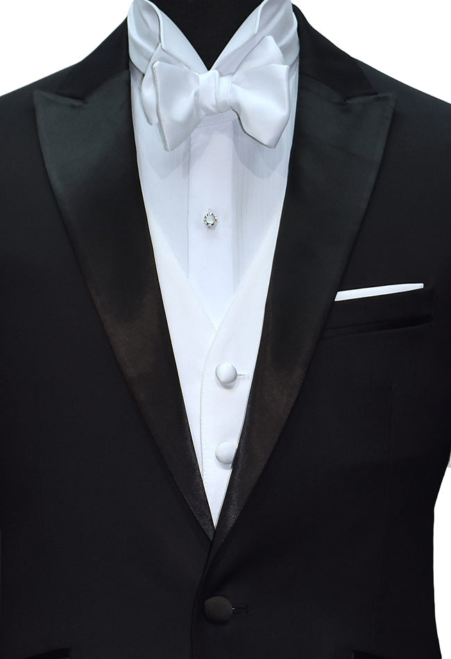 Black peak lapel tuxedo with white satin vest and white "tie-yourself" bowtie. 