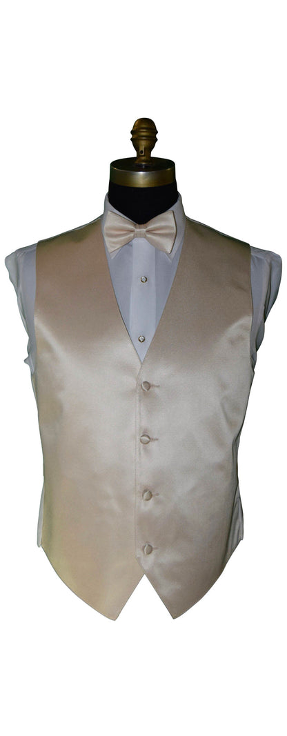 mannequin wearing a champagne tuxedo vest with a champagne bow tie against a white background