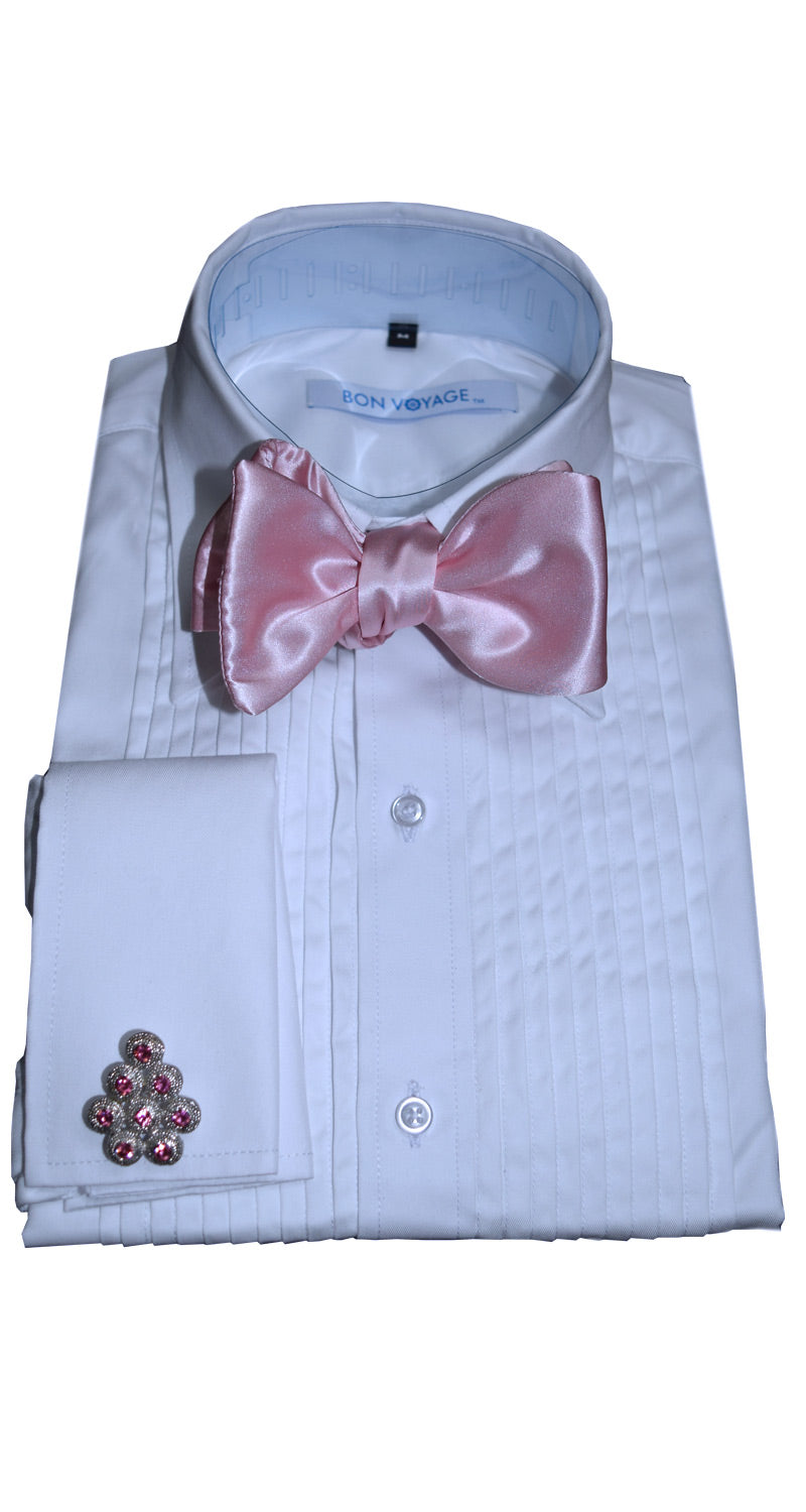 White tuxedo shirt with silk pink "tie-yourself" bow tie and cufflinks on a white background
