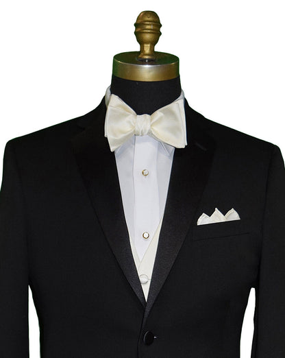 Close up of a black notch lapel tuxedo shown with a off-white "tie yourself" bowtie and off-white vest and pocket handkerchief