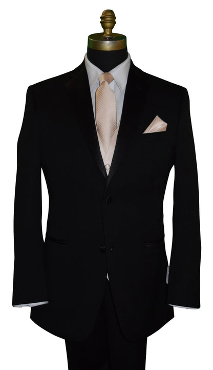 Black suit with a white shirt and nude-color tie on a mannequin against a white background