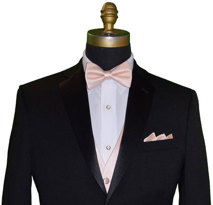 close-up Black tuxedo with "pre-tied" petal color bow tie and pocket square on a mannequin against a white background