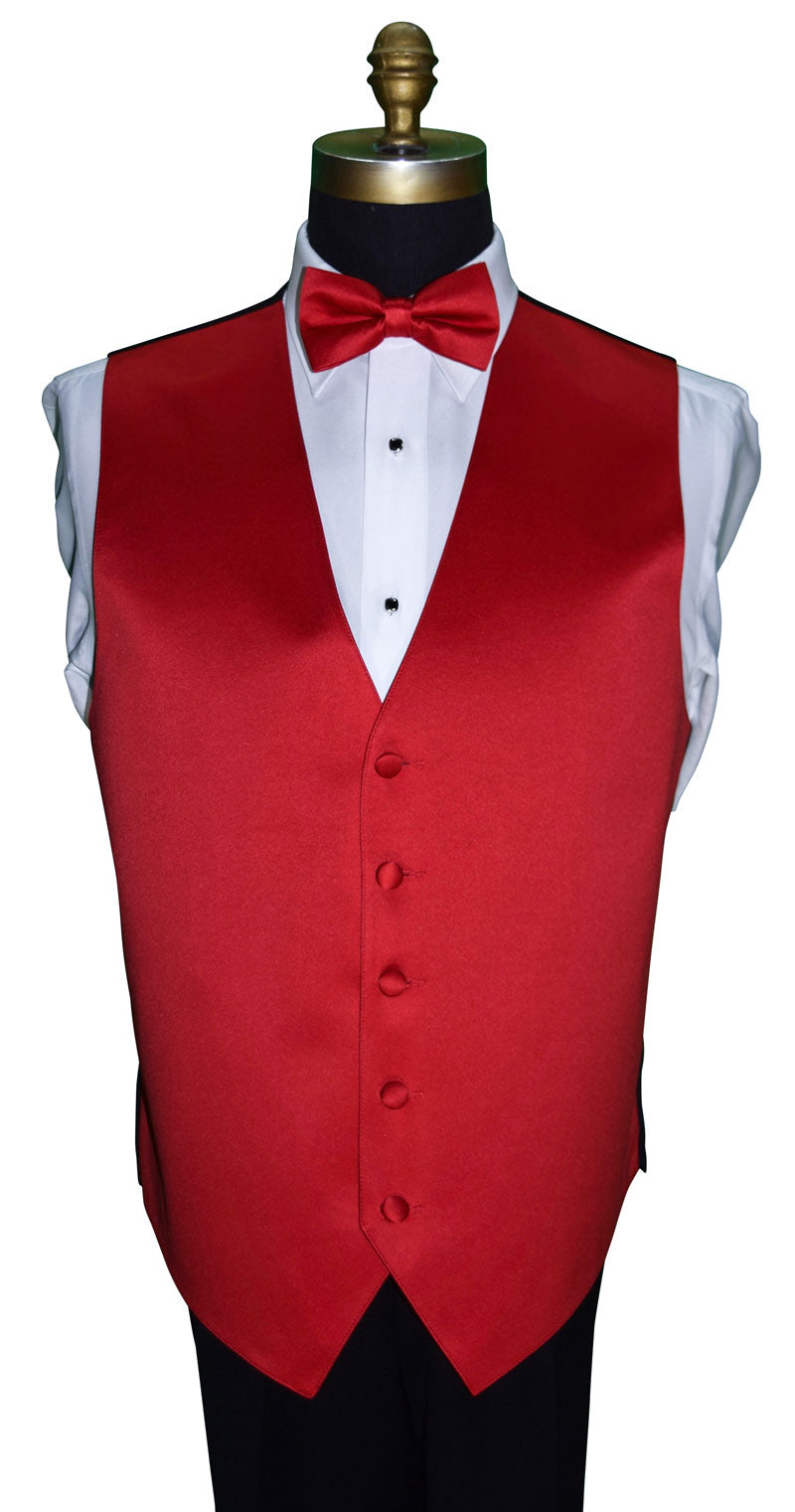 close-up mannequin wearing a white tuxedo shirt with a red satin tuxedo vest and red satin bowtie against a white background
