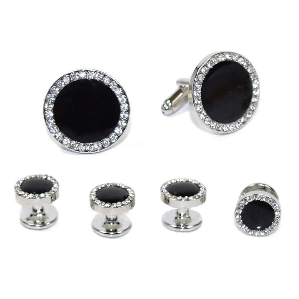 close-up of round black onyx cufflinks and studs set in silver setting with crystals