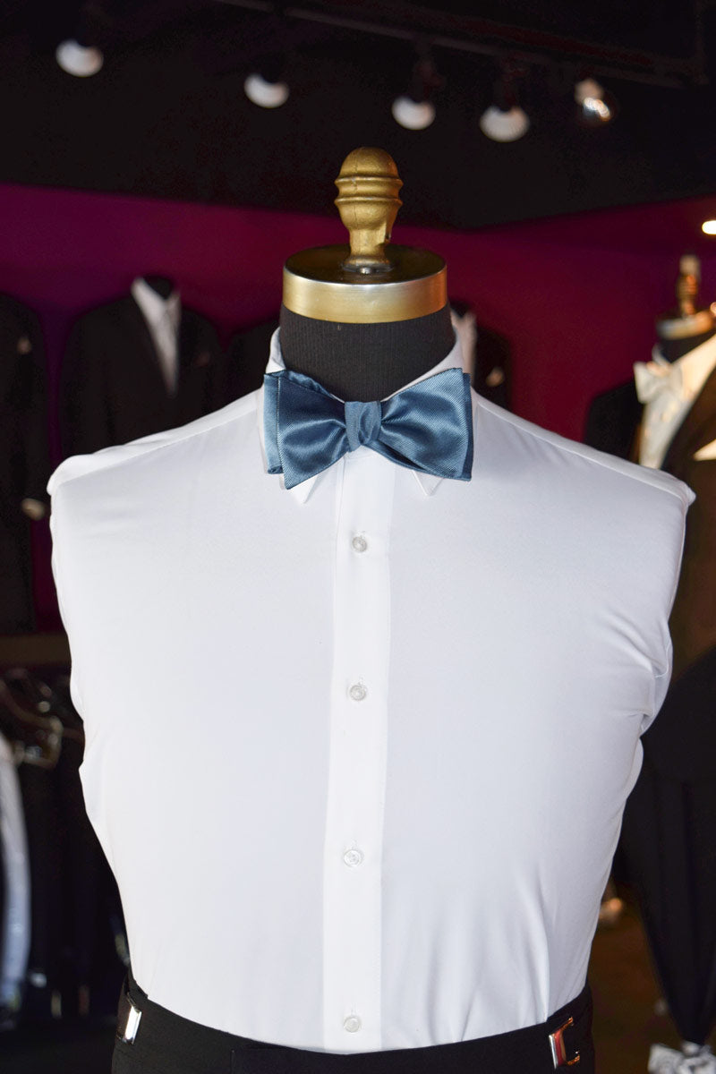 White dress shirt with a serene blue tie-yourself bow tie on a mannequin against a blurred background