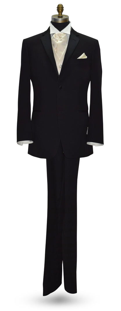 life size mannequin wearing a black notch-lapel tuxedo with an ivory tuxedo shirt and an ivory satin tuxedo vest and ivory ascot against a white background
