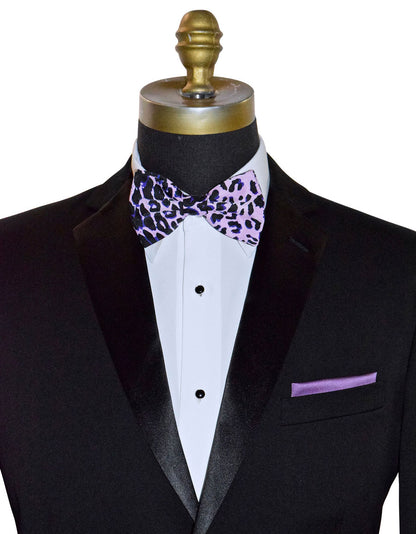 Black tuxedo with a white shirt, purple and pink leopard print bow tie, and matching pocket square on a mannequin