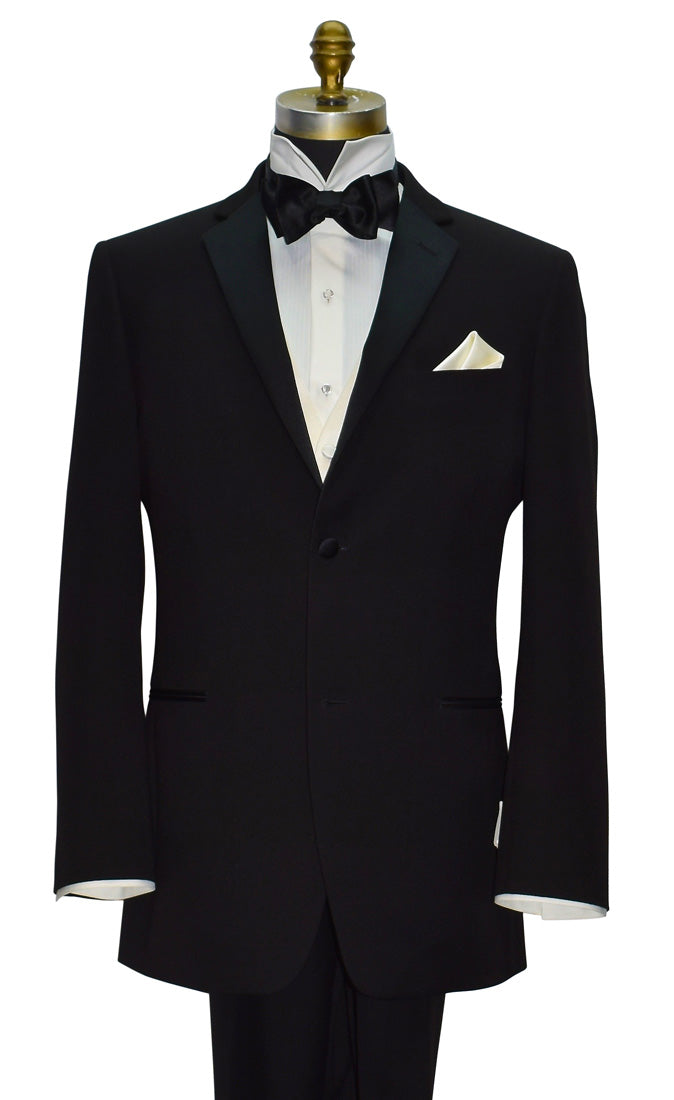 Black tuxedo with black bow tie and off-white tuxedo vest on a mannequin against a white background