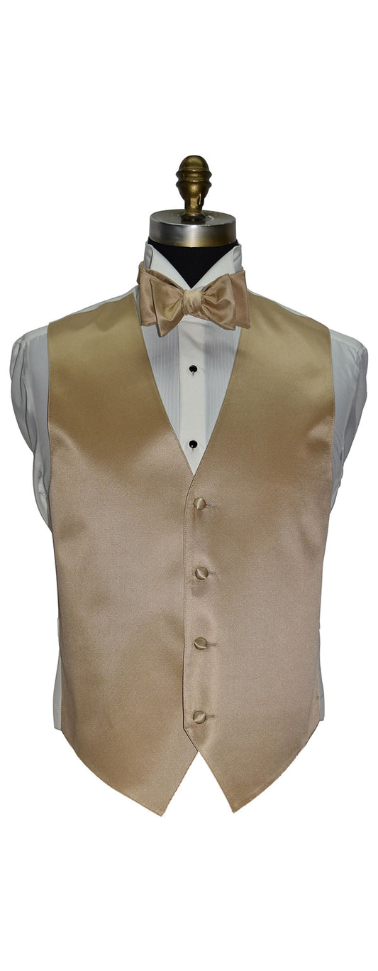 Golden tuxedo vest on a mannequin with a white shirt and golden bow tie against a white background