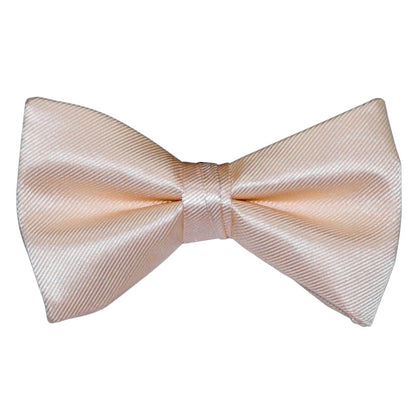 nude color "pre-tied" bow tie on a white background
